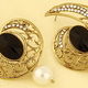 Illustration for article titled 4 Fashion Secrets to Style your Black Metal Earringsem/em